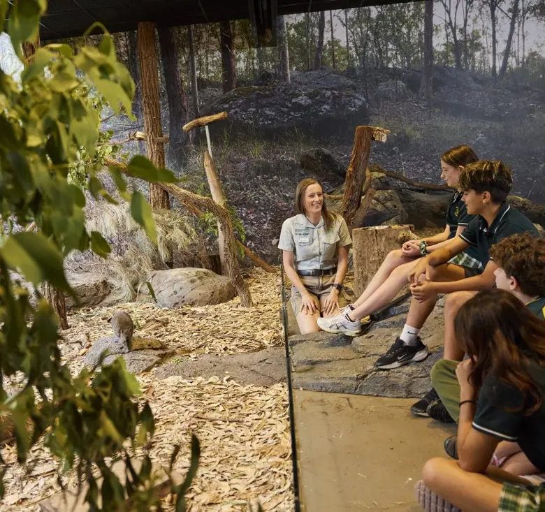 Taronga educator in bushland habitat classroom with school kids teaching them about Potoroos