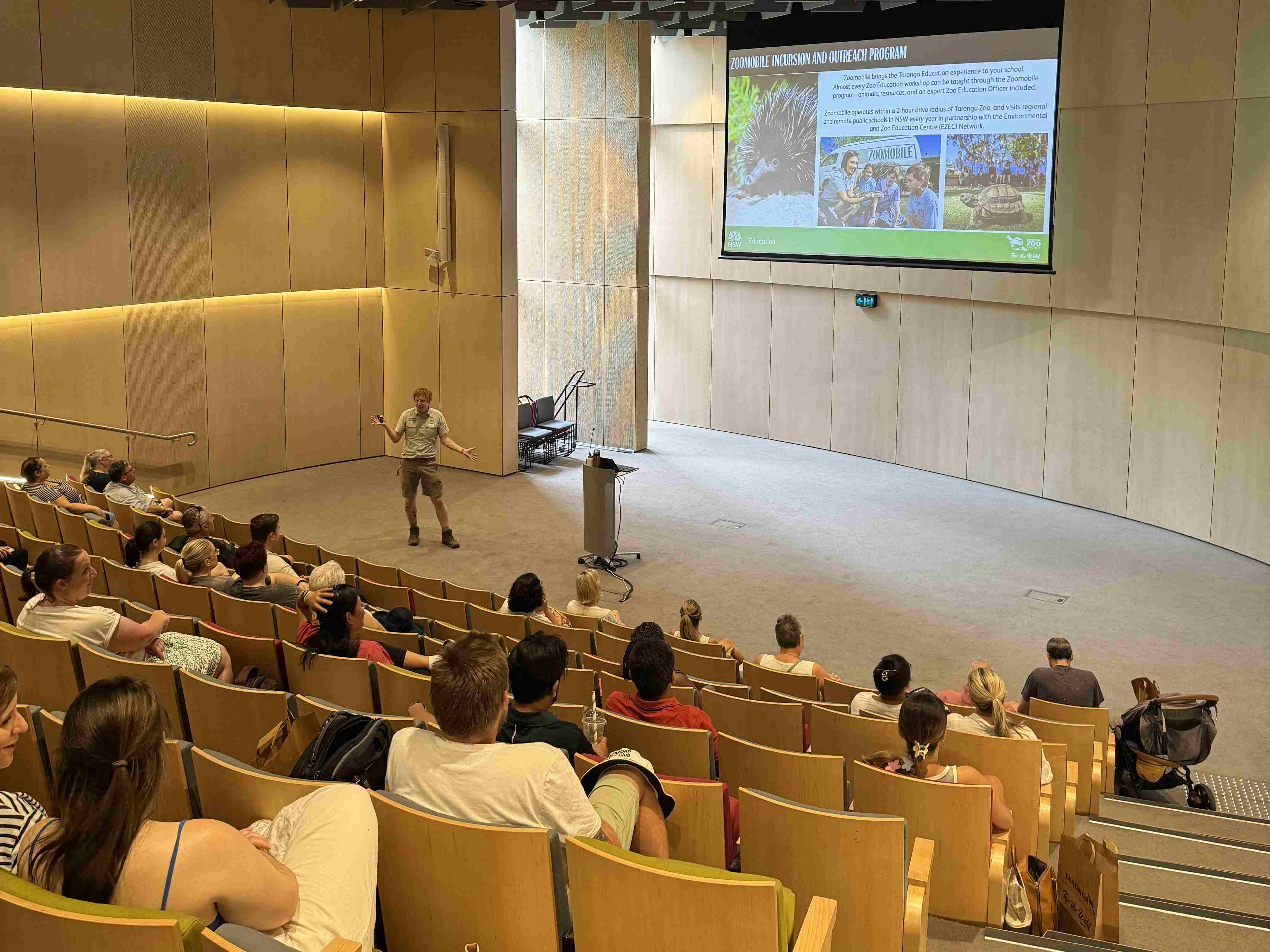 Teachers attending an education presentation in a lecture theatre.