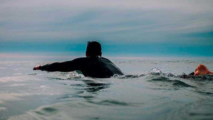 Paddling surfer