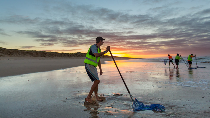 Fisherman on a beach.